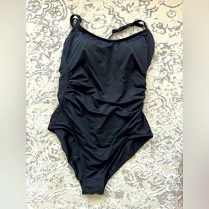 One piece swimsuit is nice and tight shapes the body